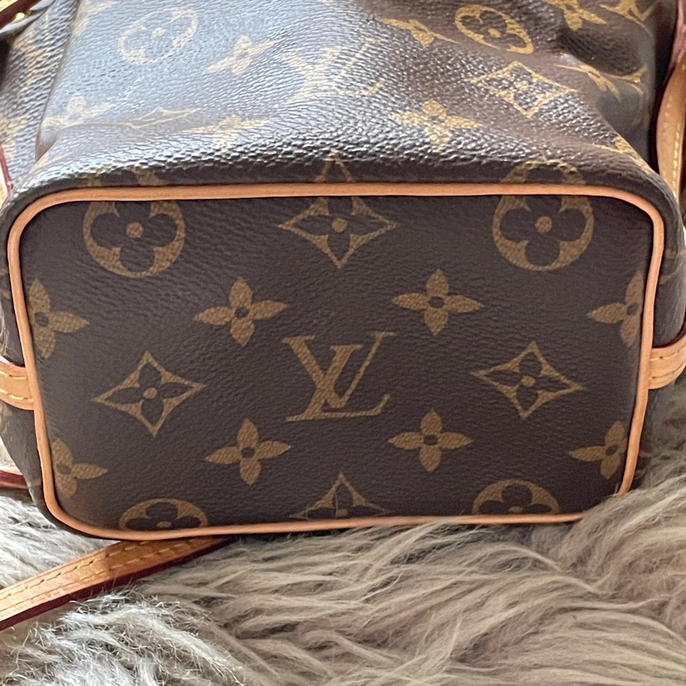 - Louis Vuitton bag. Authentic with authentication number in bottom of bag.